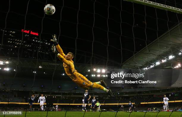 Victory goalkeeper Matt Acton is beaten by a shot from Nicolai Muller of the Wanderers during the A-League match between the Melbourne Victory and...