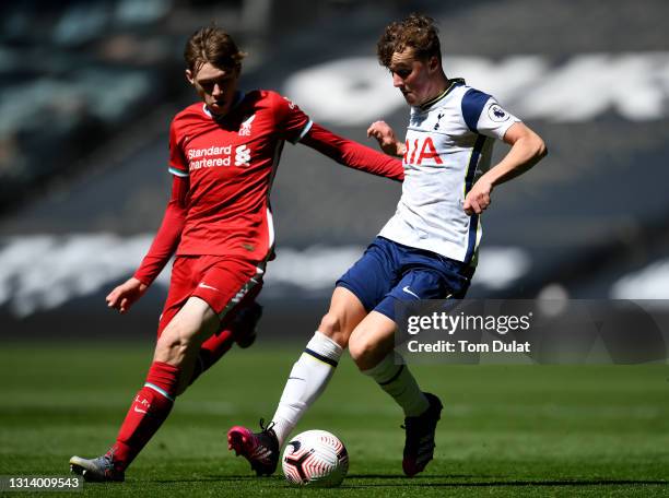 Alfie Devine of Tottenham Hotspur and Conor Bradley of Liverpool battle for the ball during the Premier League 2 match between Tottenham Hotspur and...