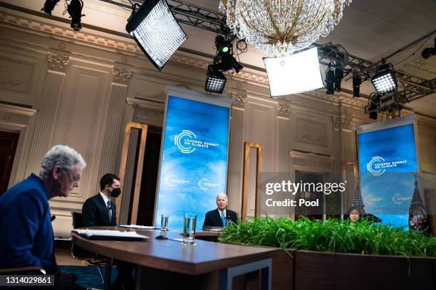 President Joe Biden delivers remarks as National Climate Adviser Gina McCarthy, Transportation Secretary Pete Buttigieg, and U.S. Trade...