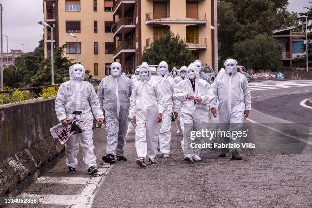 The “Ghosts of the past”, including restaurateurs, VAT numbers and gym owners gather for a flash mob protest, wearing white masks and overalls, to...