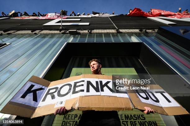Arsenal fans chant and hold placards during a protest against the club's owner Stan Kroenke ahead of the Premier League match between Arsenal and...