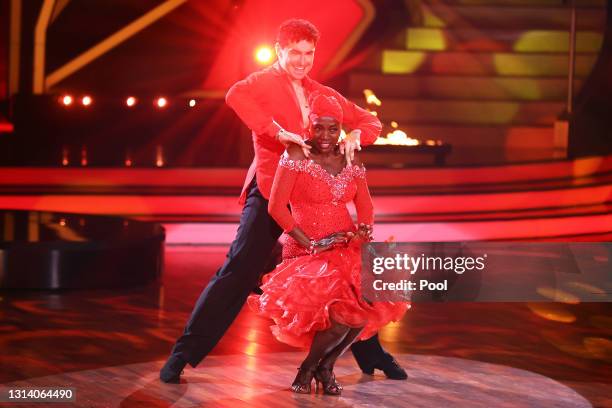 Auma Obama and Andrzej Cibis perform on stage during the 7th show of the 14th season of the television competition "Let's Dance" on April 23, 2021 in...