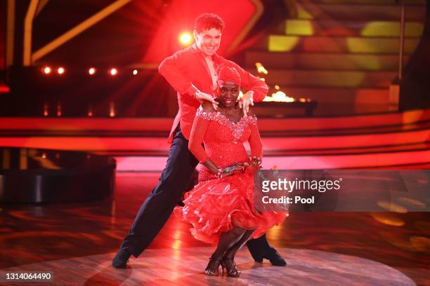 Auma Obama and Andrzej Cibis perform on stage during the 7th show of the 14th season of the television competition "Let's Dance" on April 23, 2021 in...