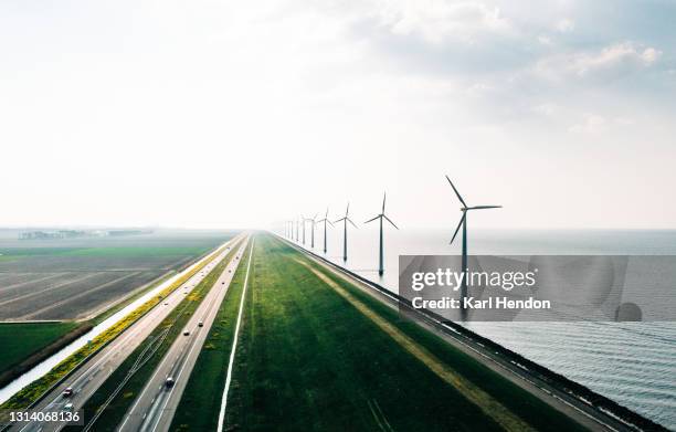 an aerial view of wind turbines, holland - stock photo - fenómeno natural fotografías e imágenes de stock