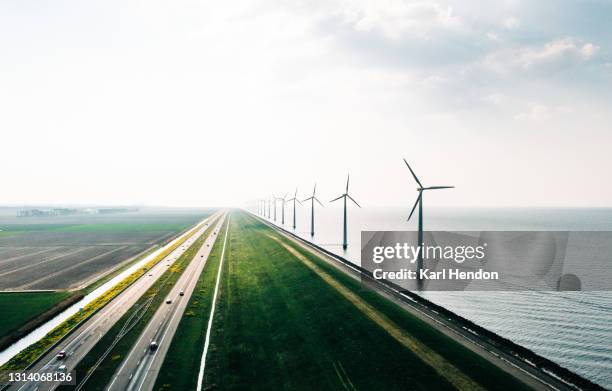 an aerial view of wind turbines, holland - stock photo - green road imagens e fotografias de stock