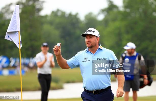Graeme McDowell of Northern Ireland reacts to his hole in one on the 17th green during the second round of the Zurich Classic of New Orleans at TPC...