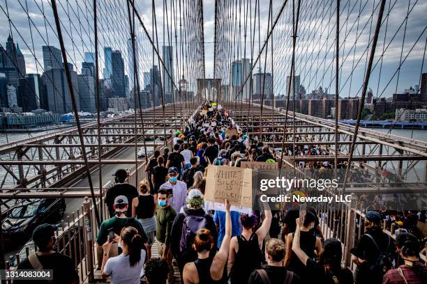 After the memorial service for George Floyd, whose death in police custody in Minneapolis sparked nationwide protests and riots, protesters walk on...