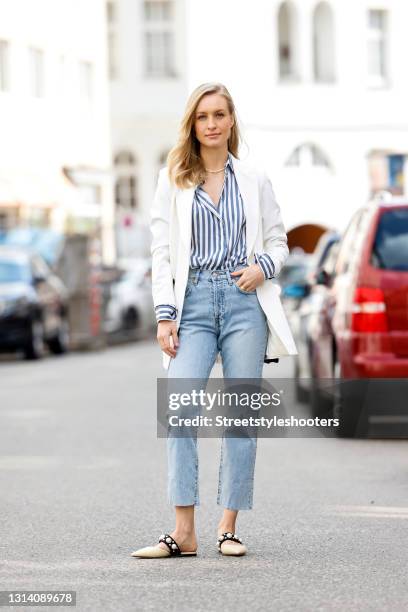 Influencer Marlies-Pia Pfeifhofer wearing a white blazer by Marcell von Berlin, a blue-white striped blouse by Longchamp, a black bag by Chanel, a...