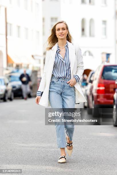 Influencer Marlies-Pia Pfeifhofer wearing a white blazer by Marcell von Berlin, a blue-white striped blouse by Longchamp, a black bag by Chanel, a...