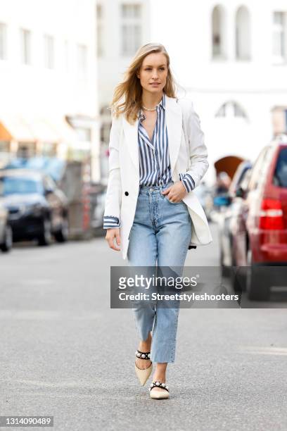 Influencer Marlies-Pia Pfeifhofer wearing a white blazer by Marcell von Berlin, a blue-white striped blouse by Longchamp, a black bag by Chanel, a...