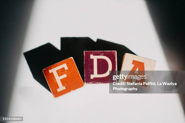 fda wrote with wooden blocks - food and drug administration photos et images de collection