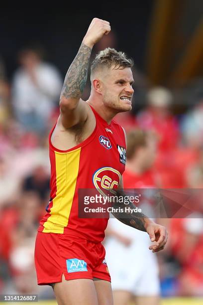 Brandon Ellis of the Suns celebrates a goal by team mate Ben King during the round six AFL match between the Gold Coast Suns and the Sydney Swans at...