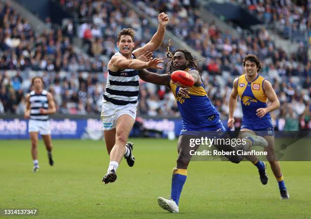 Tom Hawkins of the Cats and Nic Naitanui of the Eagles compete for the ball during the round six AFL match between the Geelong Cats and the West...