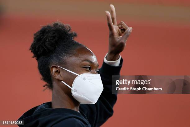 Tianna Bartoletta reacts as she runs a victory lap after winning the long jump during the Oregon Relays at Hayward Field on April 23, 2021 in Eugene,...