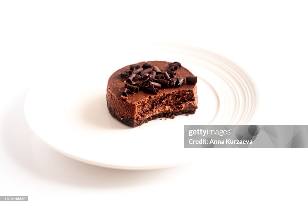 Mini chocolate cheesecake isolated on white background, selective focus