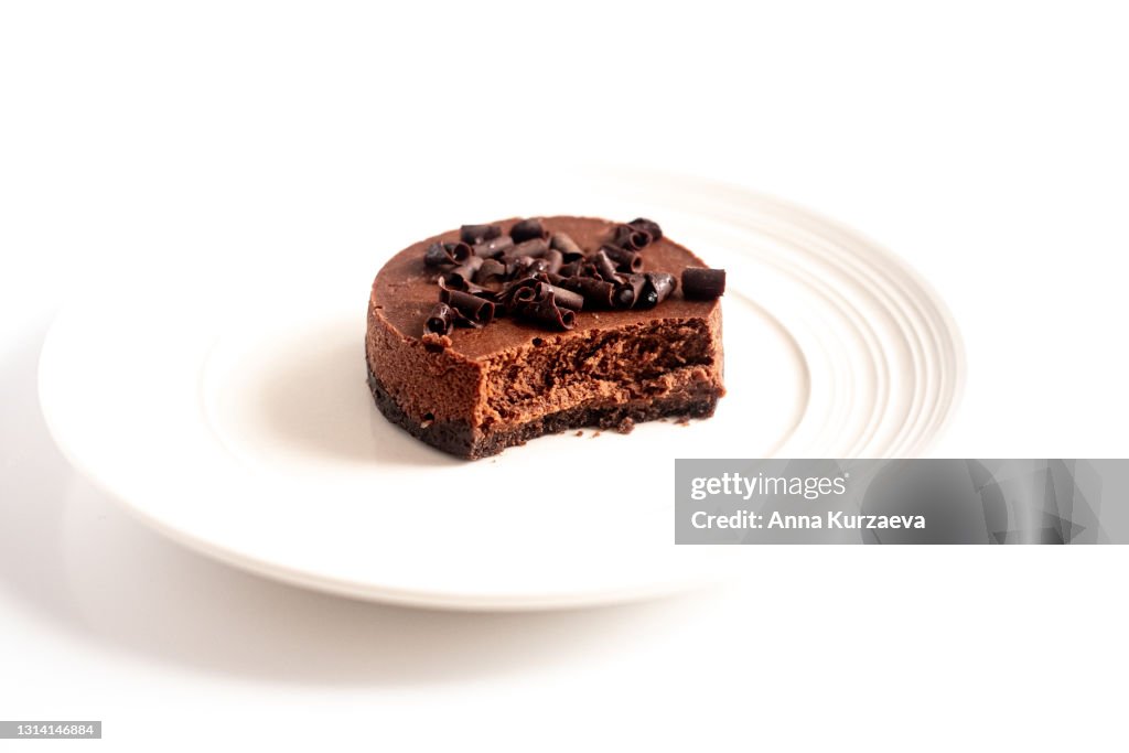 Mini chocolate cheesecake isolated on white background, selective focus