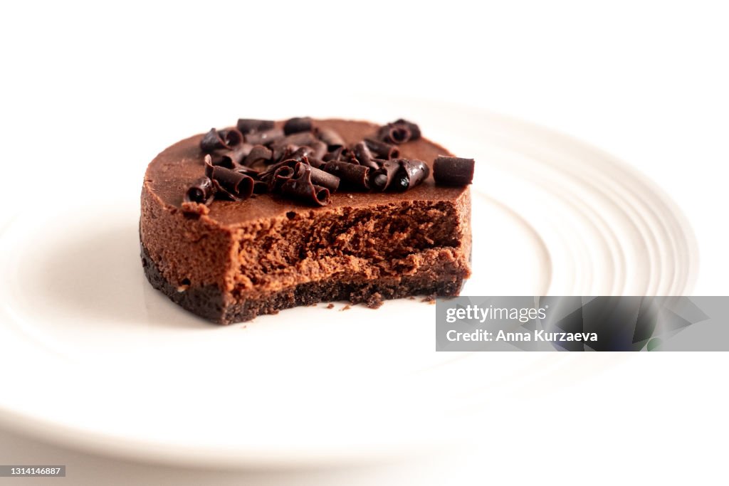 Mini chocolate cheesecake isolated on white background, selective focus