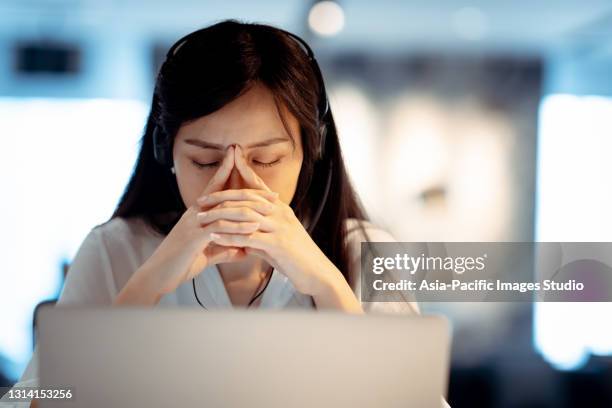 mature asian businesswoman working in office. - business meeting with masks stock pictures, royalty-free photos & images