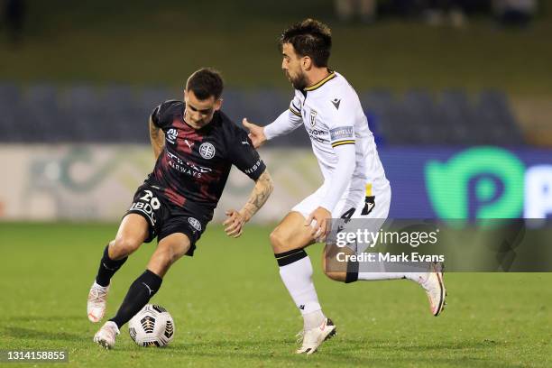 Adrian Luna of Melbourne City Is challenged by Benat Etxebarria of Macarthur FC during the A-League match between Macarthur FC and Melbourne City at...