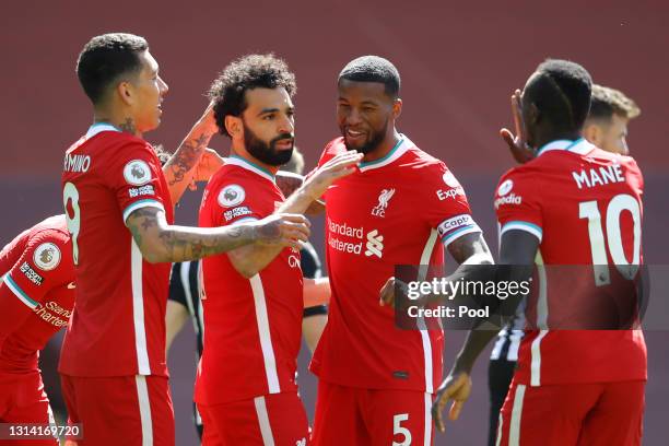 Mohamed Salah of Liverpool celebrates with team mates Roberto Firmino, Sadio Mane and Georginio Wijnaldum after scoring their side's first goal...