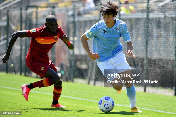 Simone Castigliani of SS Lazio competes for the ball with Maissa Codou Ndiaye of AS Roma during the Coppa Italia Primavera match between AS Roma U19...