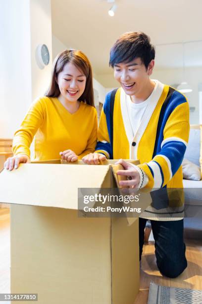 97 Asian Couple Open Parcel Stock Photos, High-Res Pictures, and Images ...