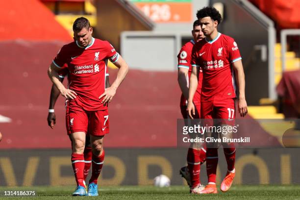James Milner and Curtis Jones of Liverpool react after the Premier League match between Liverpool and Newcastle United at Anfield on April 24, 2021...