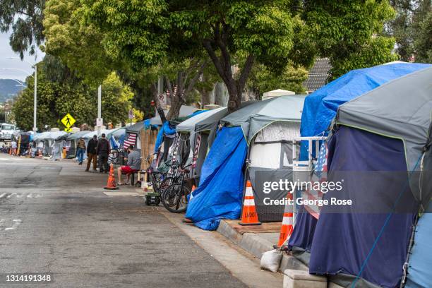 Homeless veterans are housed in 30 tents on a sidewalk along a busy San Vicente Boulevard outside the Veterans Administration campus in West Los...