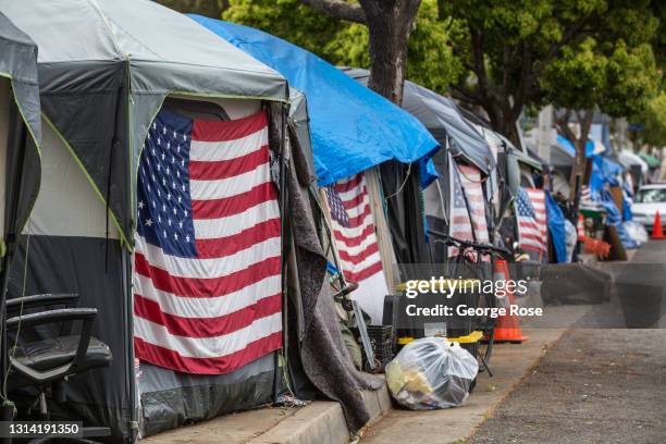 Homeless veterans are housed in 30 tents on a sidewalk along a busy San Vicente Boulevard outside the Veteran's Administration campus in West Los...