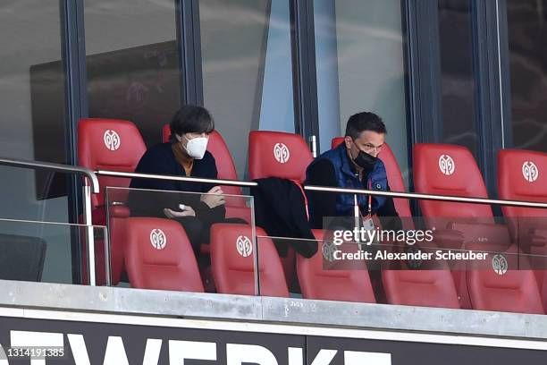 Joachim Loew, Head coach of the German national team and Christian Heidel, sporting director of 1. FSV Mainz 05 are seen in the stands during the...