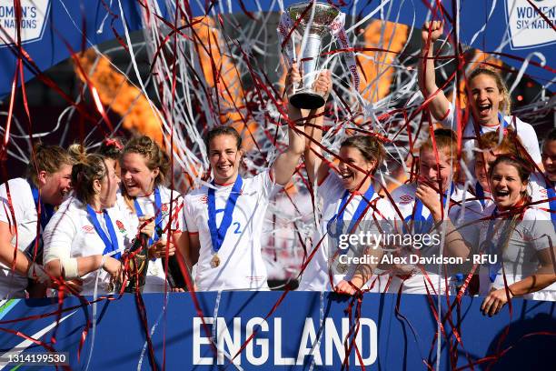 Emily Scarratt and Sarah Hunter of England lift the Six Nations Trophy following the Women's Six Nations match between England and France at The...