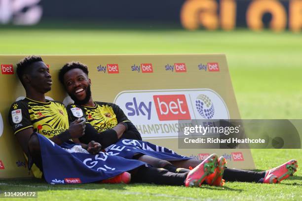 Ismaila Sarr and Nathaniel Chalobah of Watford look on at the final whistle as they are promoted to the Premier League following the Sky Bet...