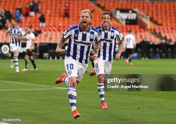 John Guidetti of Deportivo Alaves celebrates after scoring their sides first goal with team mate Tomas Pina during the La Liga Santander match...