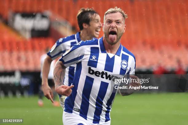 John Guidetti of Deportivo Alaves celebrates after scoring their sides first goal during the La Liga Santander match between Valencia CF and...