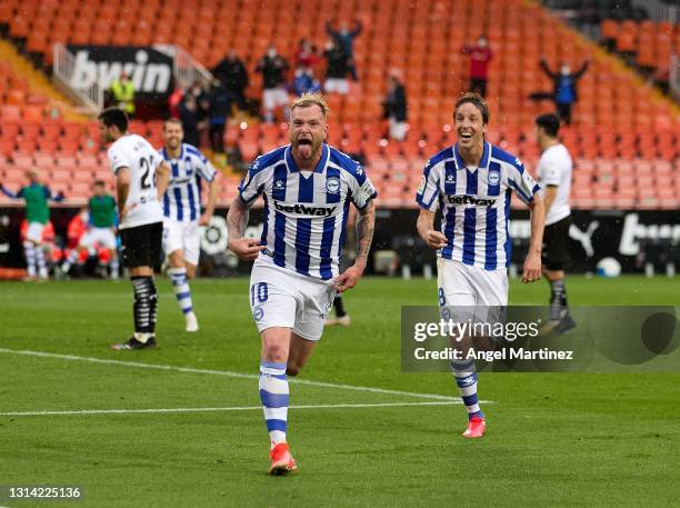 John Guidetti of Deportivo Alaves celebrates after scoring their sides first goal during the La Liga Santander match between Valencia CF and...