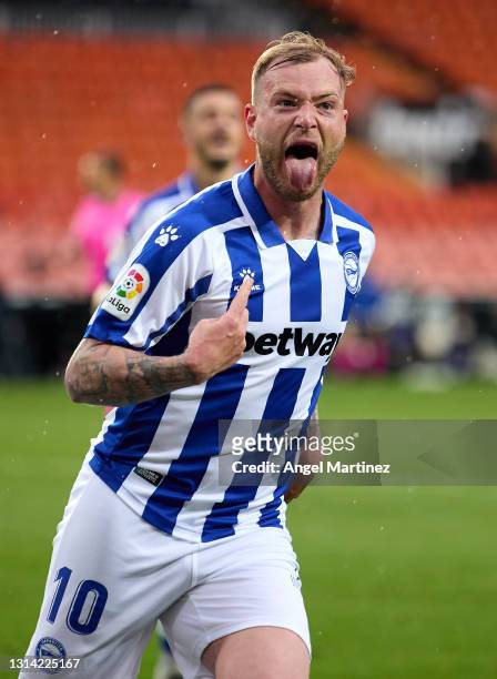 John Guidetti of Deportivo Alaves celebrates after scoring their sides first goal during the La Liga Santander match between Valencia CF and...