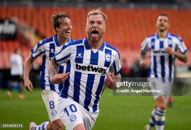 John Guidetti of Deportivo Alaves celebrates after scoring their sides first goal during the La Liga Santander match between Valencia CF and...