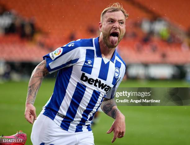 John Guidetti of Deportivo Alaves celebrates after scoring their sides first goal during the La Liga Santander match between Valencia CF and...