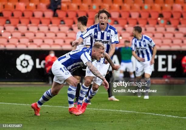 John Guidetti of Deportivo Alaves celebrates after scoring their sides first goal during the La Liga Santander match between Valencia CF and...