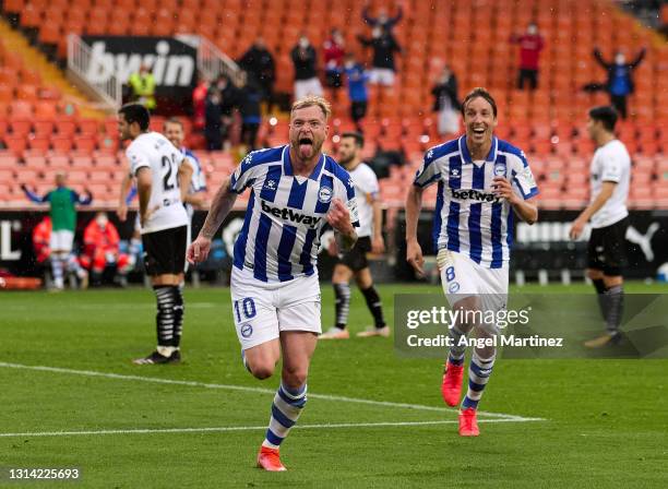 John Guidetti of Deportivo Alaves celebrates after scoring their sides first goal during the La Liga Santander match between Valencia CF and...