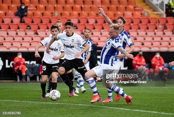 John Guidetti of Deportivo Alaves scores their sides first goal during the La Liga Santander match between Valencia CF and Deportivo Alaves at...