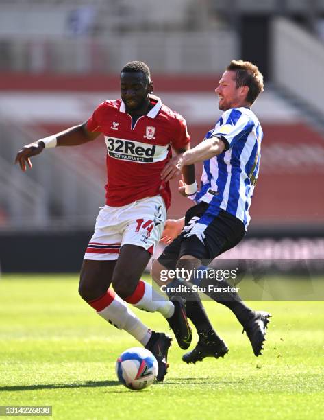 Julian Borner of Sheffield Wednesday is beaten to the ball by Yannick Bolasie during the Sky Bet Championship match between Middlesbrough and...