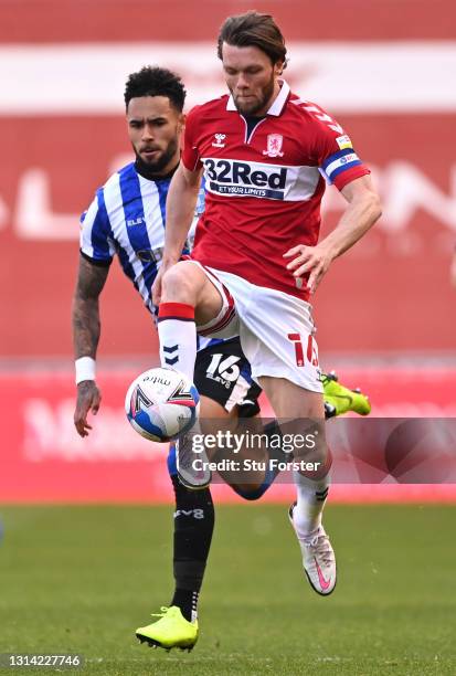 Middlesbrough player Jonny Howson beats Andre Green to the ball during the Sky Bet Championship match between Middlesbrough and Sheffield Wednesday...