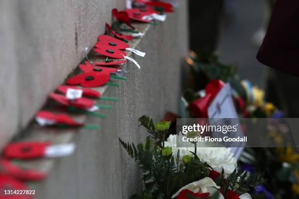 People lay poppies on the cenotaph to commemorate Anzac Day at the Auckland War Memorial Museum on April 25, 2021 in Auckland, New Zealand. Anzac day...