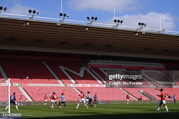 General view of the action played in an empty stadium with the lettering 'MFC' pictured on the vacant seating during the Sky Bet Championship match...