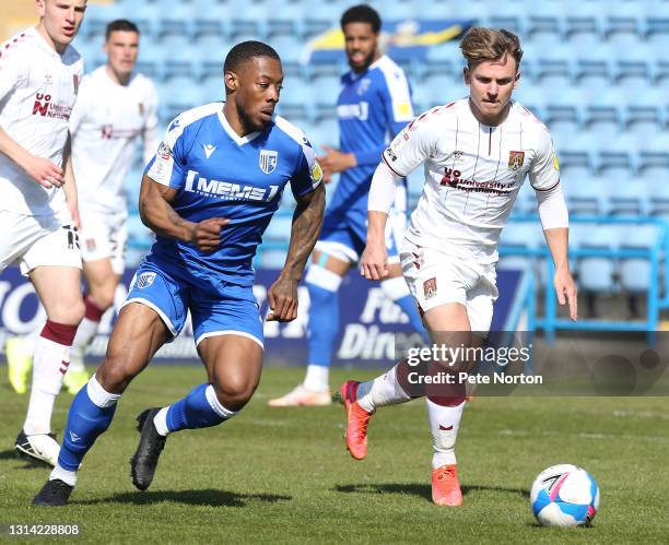 Ryan Jackson of Gillingham moves forward with the ball watched by Sam Hoskins of Northampton Town during the Sky Bet League One match between...