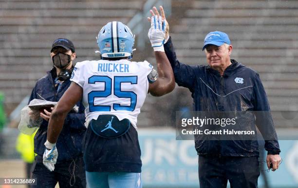Head coach Mack Brown and Kaimon Rucker of North Carolina Tar Heels react at the start of the fourth quarter during their spring game at Kenan...
