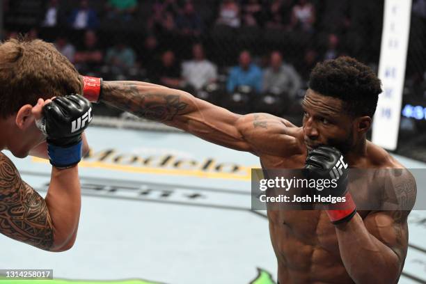 Karl Roberson punches Brendan Allen in their middleweight bout during the UFC 261 event at VyStar Veterans Memorial Arena on April 24, 2021 in...
