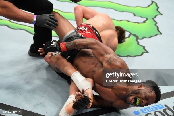 Karl Roberson reacts while being submitted via heel hook by Brendan Allen in their middleweight bout during the UFC 261 event at VyStar Veterans...