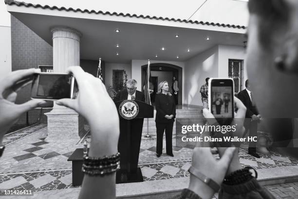 Ambassador to Libya, Gene Kretz, introduces Secretary of State Hillary Clinton before a speech to the staff and families at the recently-opened U.S....